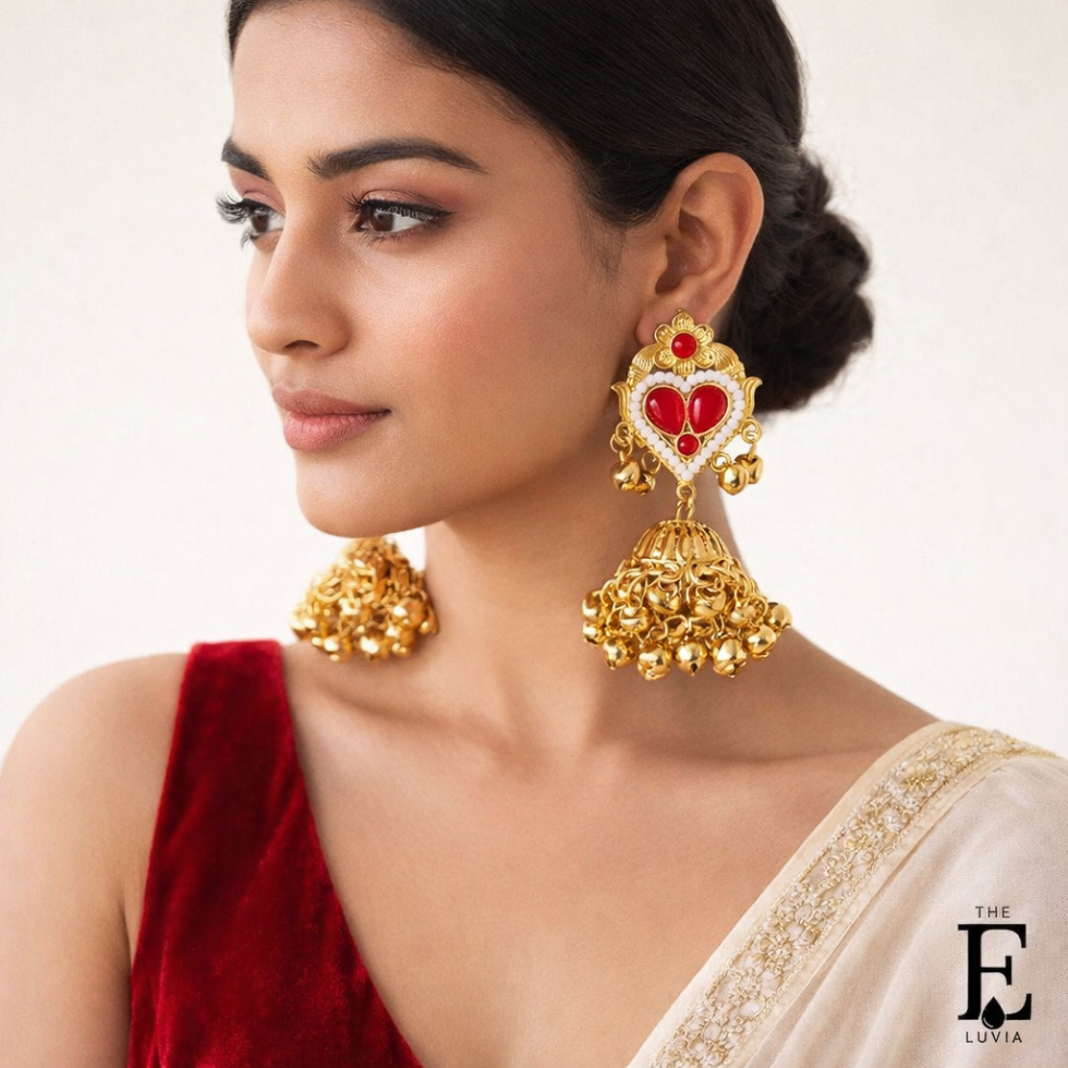 Luxury gold jhumka earrings with red stones and pearl detailing-model-1